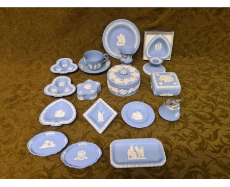 Wedgwood blue Jasperware, 17 pieces including lidded dishes, table lighter, pin trays, etc.