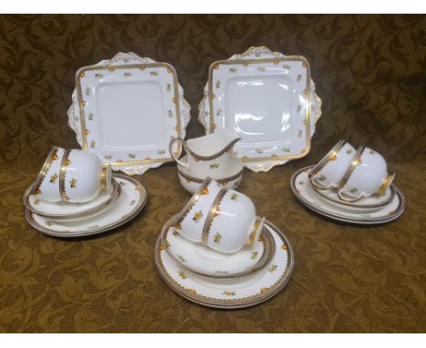 Paragon china teaset decorated with gilt geometric borders and floral motifs.  6 cups (3 with cracks), saucers, plates, sugar