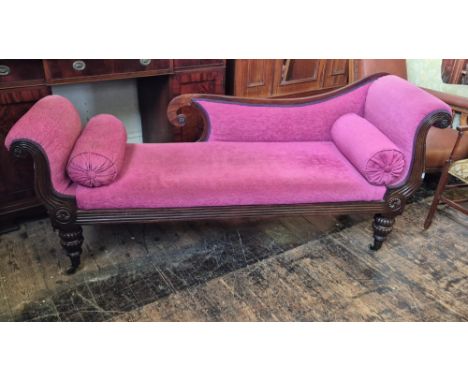 Regency mahogany sofa with reeded scroll ends and front rail upon melon turned legs with brass castors and matching carved ro