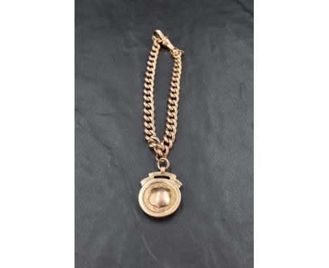 A 9ct rose gold curb link bracelet with attached 9ct gold medallion, approx 34.2g