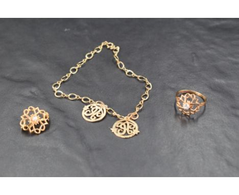 Three pieces of 9ct gold jewellery awarded to Avon reps including a brooch, ring and bracelet, approx 6.7g