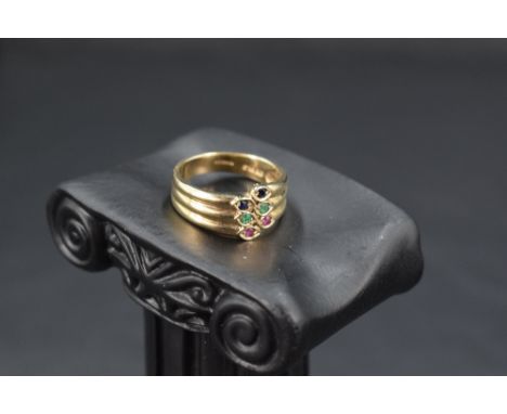 A 9ct gold triple band ring having gem set terminals, size N &amp; approx 3.9g