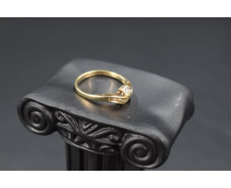 A 9ct gold serpent style ring having diamond chip decoration, size O &amp; approx 2g