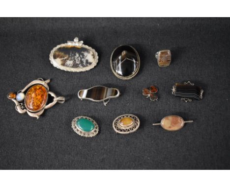 Ten pieces of silver and white metal jewellery all having polished stones, including oversized pendant, ring and brooches