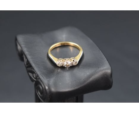 A diamond trilogy ring, approx 0.5ct total in a claw set mount on an 18ct gold loop, size L &amp; approx 2.6g