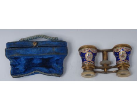 A pair of 19th century French enamel and gilt brass opera glasses, mother of pearl eyepieces, the ogee barrels engine turned 