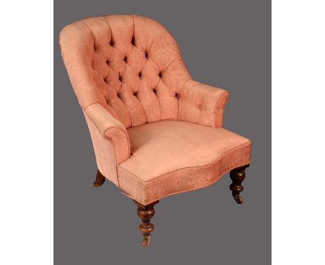A Victorian walnut button-back easy chair, stuffed-over upholstery, turned legs, ceramic casters, c.1860