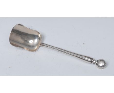 An Arts and Crafts silver caddy or sugar spoon, bun shaped terminal, lobed stem, shovel shaped bowl, 14cm long, Hilliard & Th