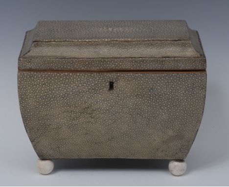 A late George III shagreen sarcophagus tea caddy, hinged cover enclosing a pair of lidded compartments, ball feet, 15.5cm hig