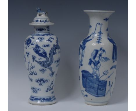 An early 19th century Chinese ovoid vase, painted in underglaze blue with figures in various poses, 26cm high, Kangxi marks b