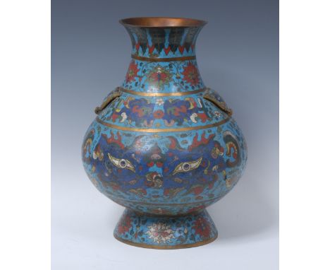 A large Chinese cloisonné enamel baluster vase, brightly decorated in polychrome with stylised motifs, flared foot, 37cm high
