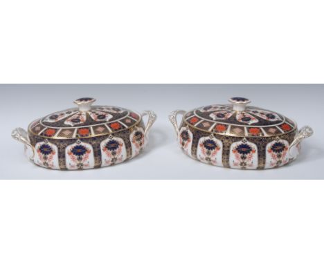 A pair of Royal Crown Derby 1128 pattern oval two-handled tureens and covers, button finials, 32cm wide, printed marks    Con