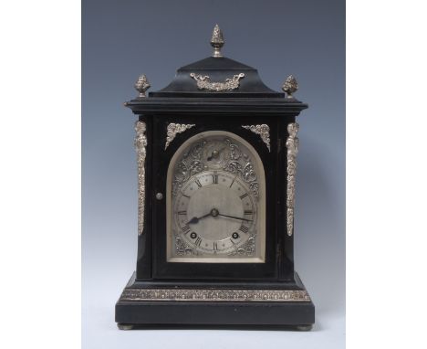 A 19th century silvered metal mounted ebonised bracket clock, 15cm arched dial inscribed with Roman and subsidiary Arabic num