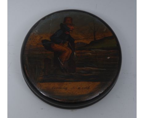 A 19th century circular papier mache snuff box, painted with Syntax type character fishing, inscribed 'Catching - A Cold', 8c