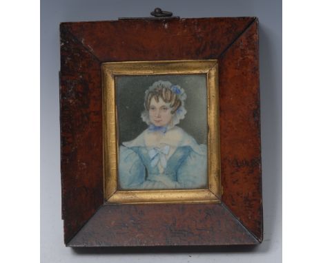 English School (19th century), a portrait miniature, of a lady wearing a blue dress, her hair with flowers and a lace cap, 8c