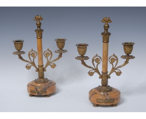 A pair of 19th century Sienna marble and ormolu two-light candelabra, flaming grenade finials, lotus cast campana sconces and