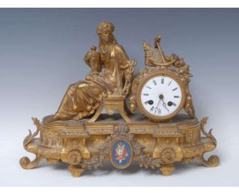 A 19th century French porcelain mounted gilt metal mantel clock, 7.5cm enamel dial inscribed with Roman numerals, twin windin