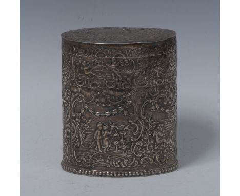 A late 19th century silver oval tea caddy, embossed with with courting putti amongst scrolls and flowers, hinged cover, beade