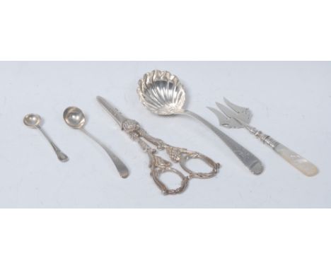 A pair of Victorian  silver grape shears, cast with fruiting vine, William Hutton & Sons (Edward Hutton), London 1887; a silv