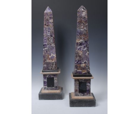 A pair of substantial amethyst quartz library obelisks, applied throughout with well figured segments, square plinth bases, 7