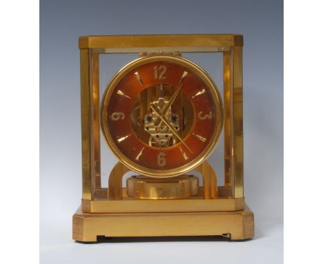 A Jaeger-Le Coultre Atmos Classic V mantel clock, the perpetual gilt brass movement, circular bronzed chapter ring, Arabic nu
