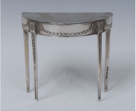 A George V novelty trinket box,  in the form of a Sheraton Revival demi-lune table, velvet lined interior, 10cm high,  John R