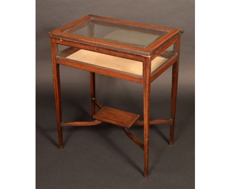 A 19th century mahogany bijouterie table, crossbanded and ebony and satinwood strung, bevelled glass, tapering square legs, s