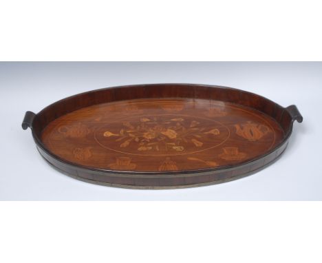 A 19th century Dutch brass bound mahogany and marquetry oval gallery tray, the field inlaid with a spray of flowers and artic