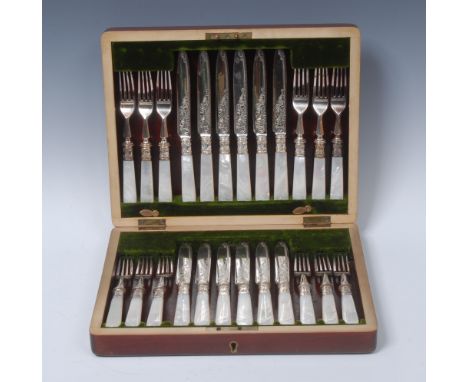 An early 20th century E.P.N.S dessert service, comprising twelve pairs of fruit knives and forks, the blades engraved with sc