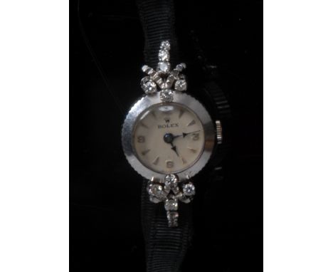 Rolex - a vintage lady's 18ct white gold diamond set cocktail watch, cream dial, quartered Roman numerals, arrow batons, blue