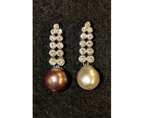  A pair of pearl and diamond drop earrings, each with an articulated graduating drop of four pairs of round cut diamonds, sus