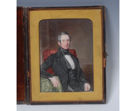 William Egley (1795-1870), a portrait miniature, of Henry Dammett Esq, seated beside a table, inscribed to verso Henry Dammet