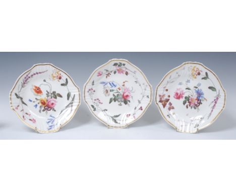 A set of three H & R Daniel shaped circular plates, painted by Pollard, with colourful floral spray and foliate samples, gilt