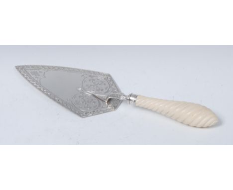 A Victorian silver trowel, pointed blade engraved with Gothic strapwork within a border of lozenges, wrythen ivory handle, 30