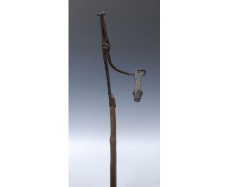 A 19th century wood and iron floor standing nip rush light holder, cruciform base, 142cm high 