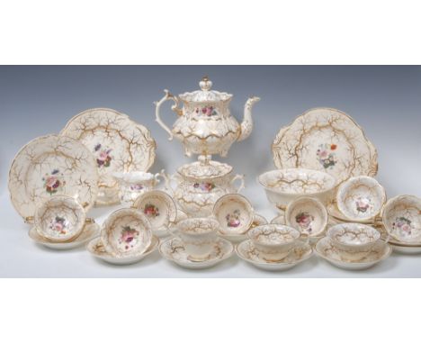 A 19th century Rockingham tea service, comprising teapot and cover, sucrier and cover, milk jug, slop bowl, two bread and but