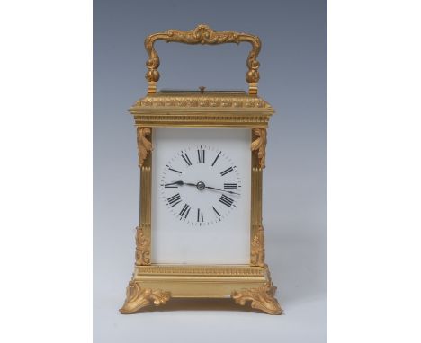 A French gilt brass quarter-repeating carriage clock, white dial with Roman numerals, eight-day movement striking on a gong, 