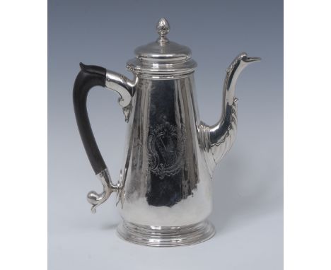 A George II silver coffee pot, pine cone finial, hinged domed cover, the spout applied with acanthus cut-card work, fruitwood