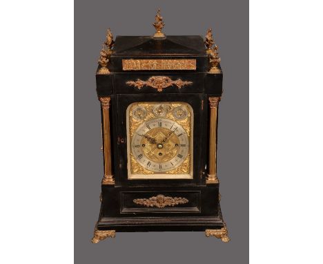A  late 19th century ebonised and gilt metal mounted bracket clock, 18cm rounded rectangular dial with silvered chapter ring,