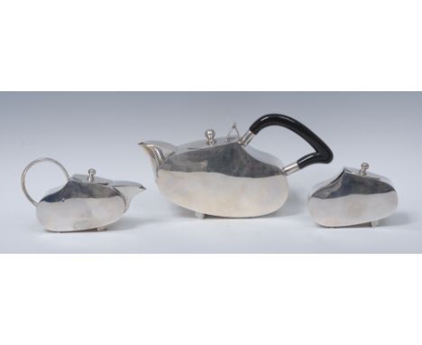 Modern Design - an Indian Art Deco style three piece tea service, comprising teapot, milk jug and sugar basin, each of stream