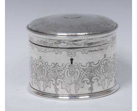 A Victorian silver cylindrical tea caddy, hinged domed cover centred by a vacant circular reserve, engraved with broad bands 