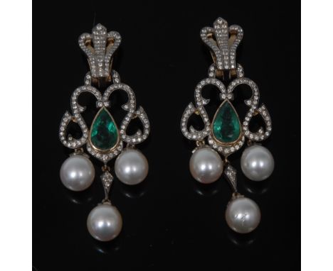 A pair of Renaissance Revival diamond, emerald and pearl earrings, each central pear shaped stone colett set within and openw