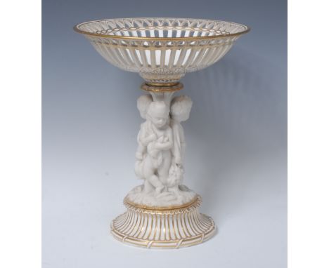 A 19th century English porcelain and parian figural table centrepiece, pierced basket above three scantily clad putti with hu