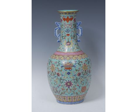 A Chinese ovoid vase, brightly decorated in polychrome enamels with bats, precious objects and flowers, on a turquoise ground