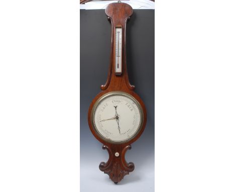 A large Victorian mahogany wheel barometer, 28cm register, alcohol thermometer, the onion top case with C-scroll borders, aca