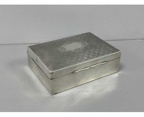 A Hallmarked Silver Cigarette Box, J.G Ltd, Birmingham 1925, the hinged lid of engine turned design, with vacant centre carto