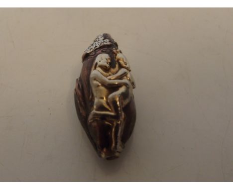 Bronzed and erotic netsuke, gold and silver wiped
