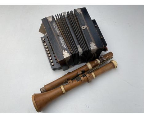 A vintage wooden Clement &amp; Co. recorder together with a mini accordion 
