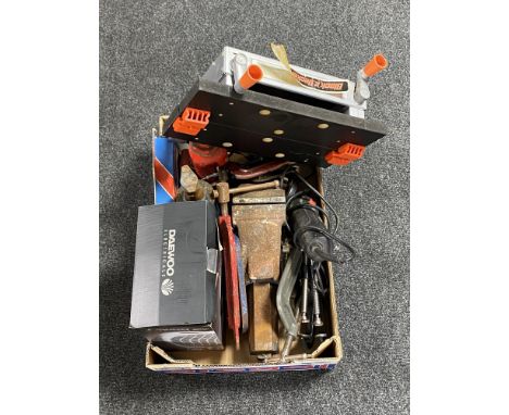 A box containing bottle jacks, heavy duty bench vice, miniature Black &amp; Decker workbench, assorted G clamps