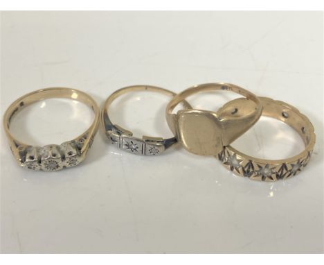 Three 9ct gold rings and another ring, indistinctly stamped (4) CONDITION REPORT: 7.7g gross. 